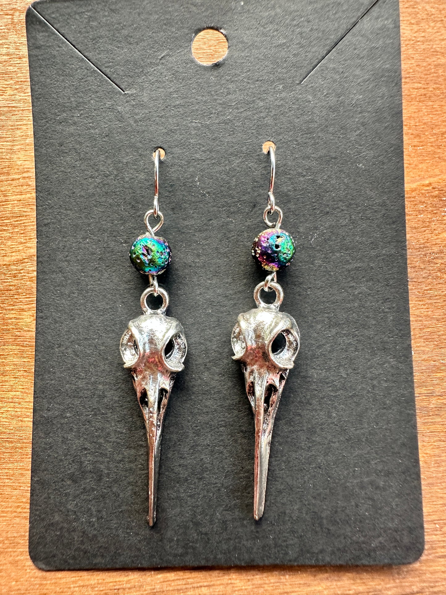 Silver & rainbow raven skulls